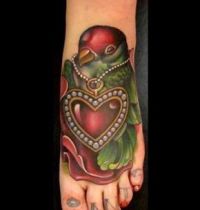 Red and green bird with heart